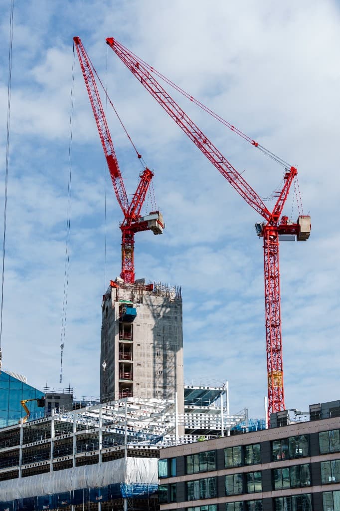 Skyscrapers under construction with cranes